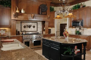 Traditional luxury kitchen with wooden cabinets, granite countertops, and a central island.